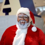 A Black man in a Santa Claus suit