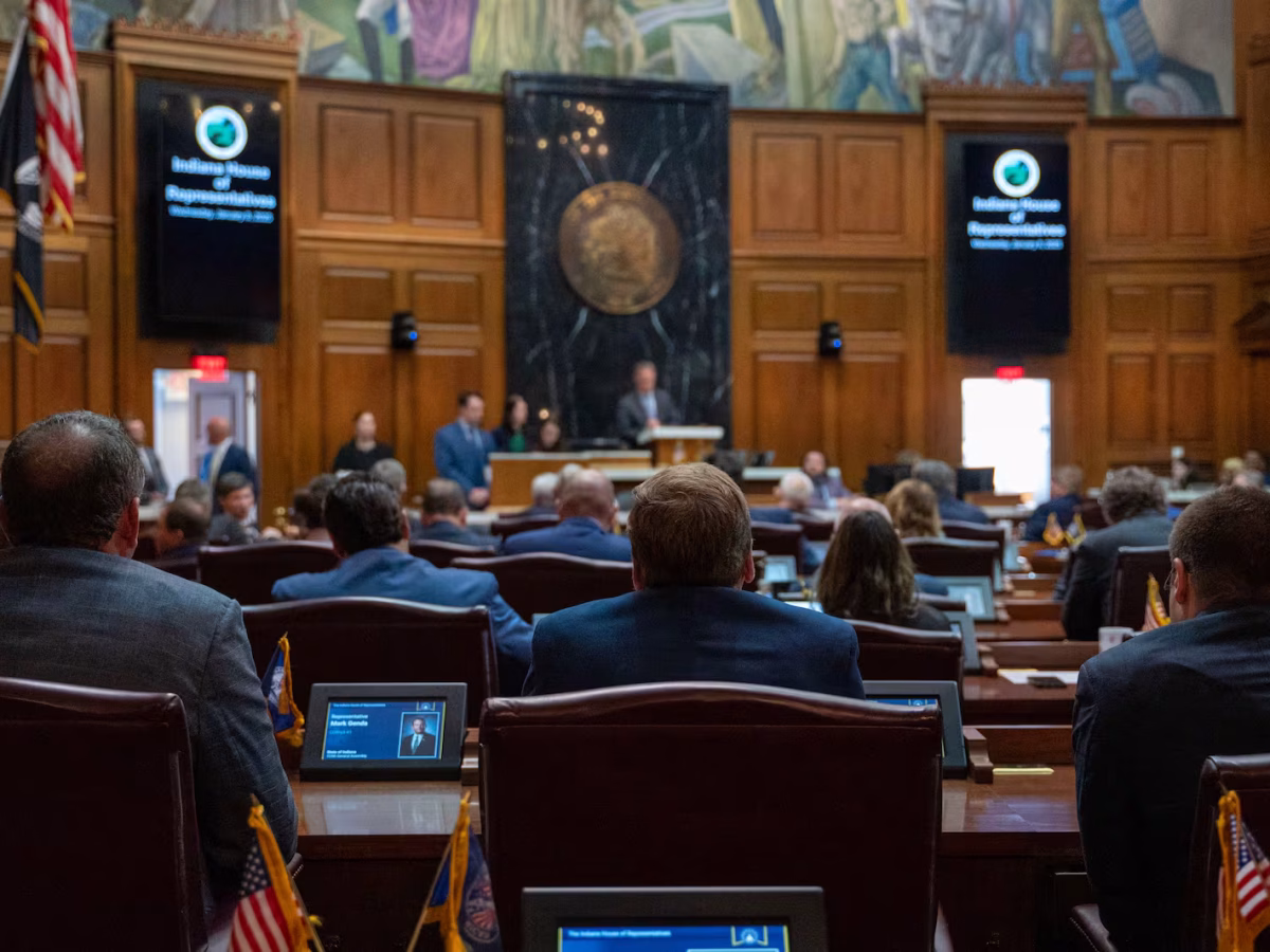 Photo shows a the Indiana House of Representatives chamber filled with lawmakers.