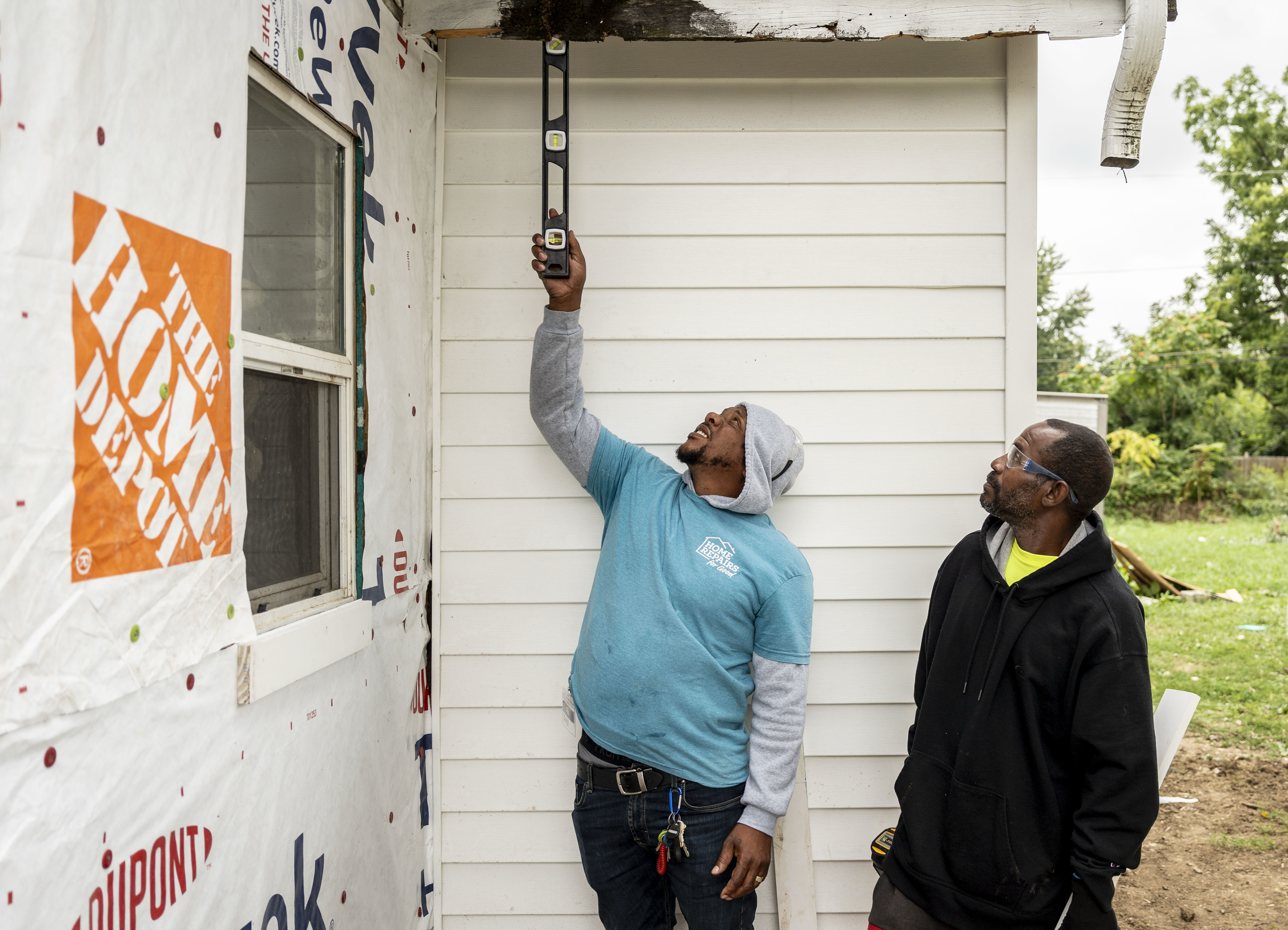 Bobby Bland (left) points out areas of the home that need repairs to Tyrie Smith, a student with the Indiana Construction Roundtable Foundation, during a work experience program with Home Repairs for Good on Aug. 21, 2025, in Indianapolis.