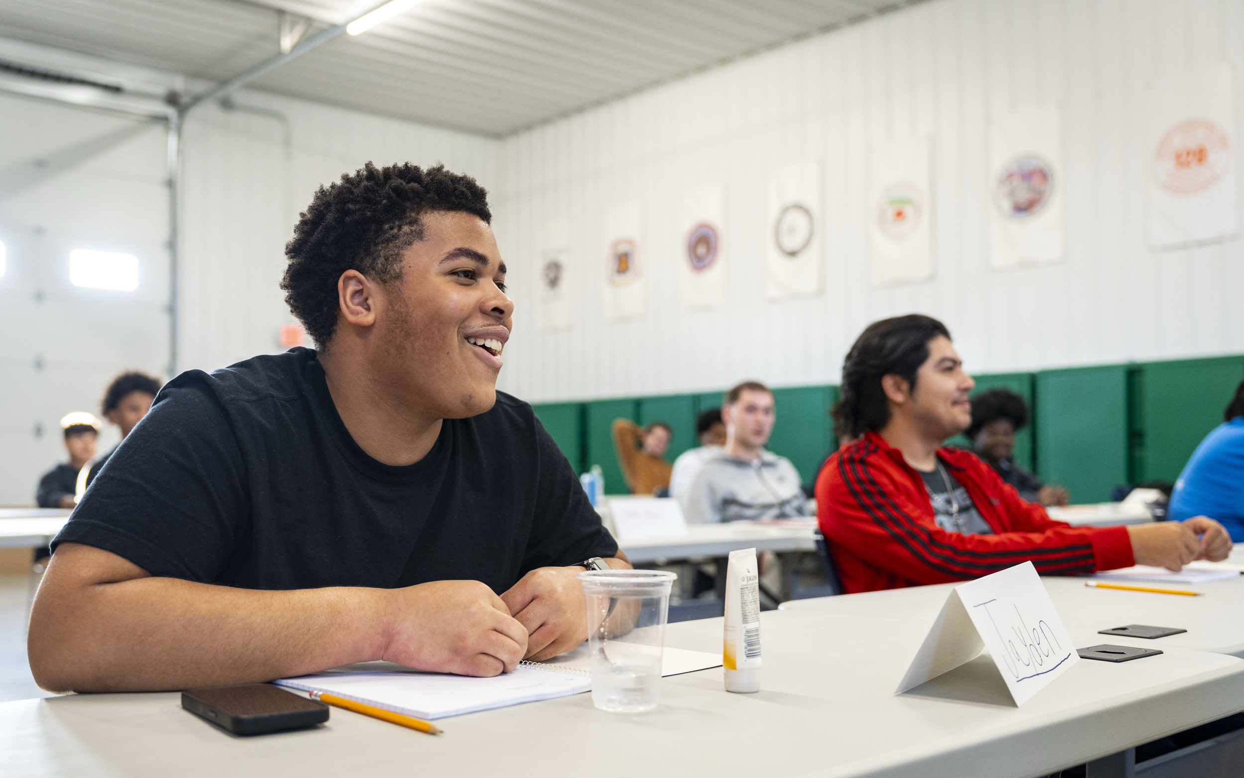 Jayden Dossett talks with Indiana Plan executive director Devon Doss during the first day of class, Sept. 15, 2025, at Indiana Plan's office in Indianapolis.